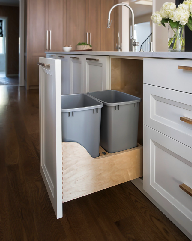 Pull out trash bins inside a cabinet